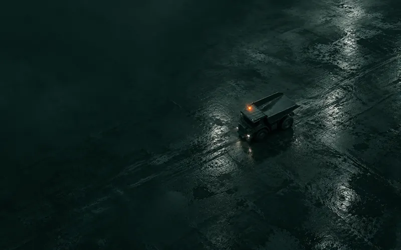 A single autonomous vehicle alone in an empty yard, with nothing around it to reference.
